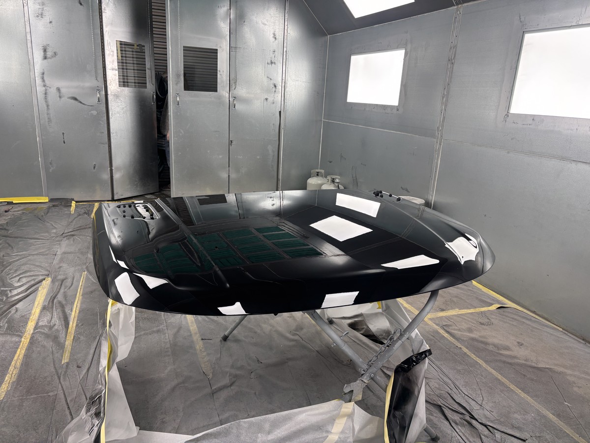 Hood with glass finish in paint booth