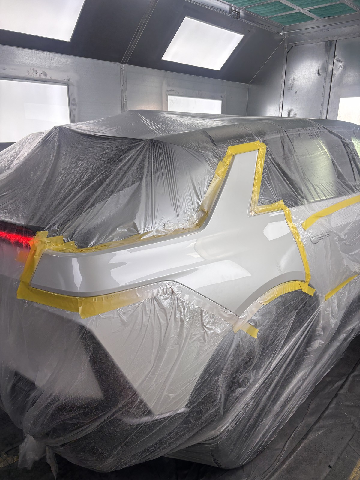 Quarter panel fresh finish in paint booth