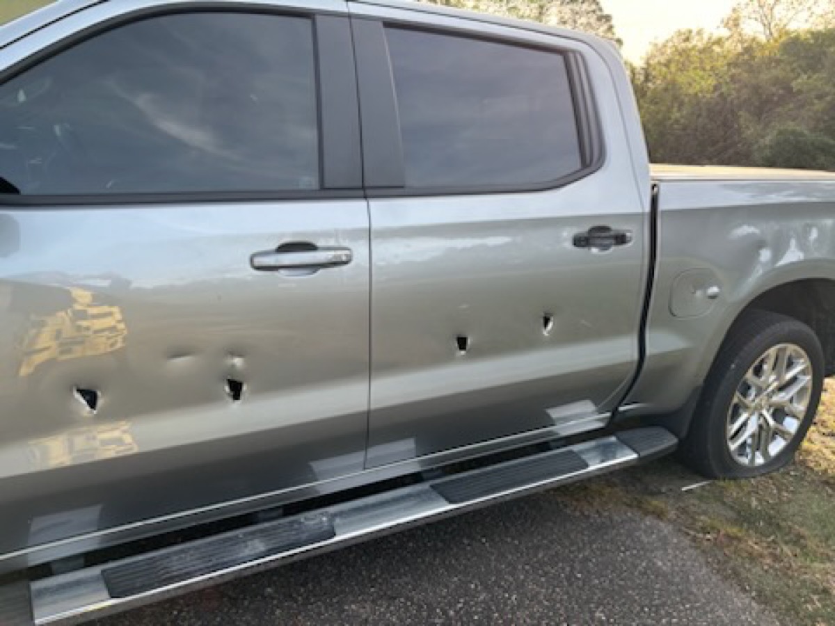 Silverado door and body damage before repair